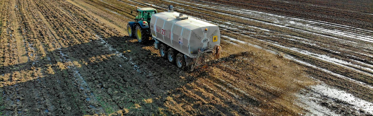 Sewage sludge being spread on field Pascvii