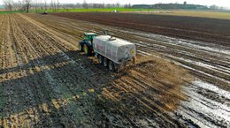 Sewage sludge being spread on field Pascvii