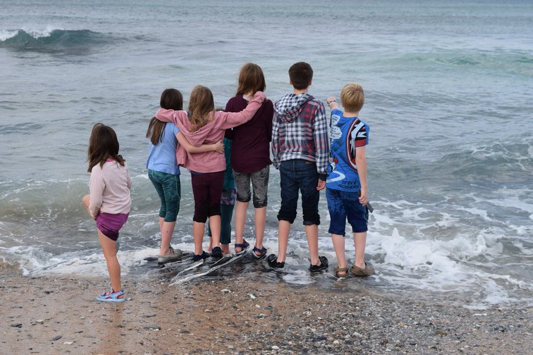 Children wave jumping Cornwall Sue Ranger