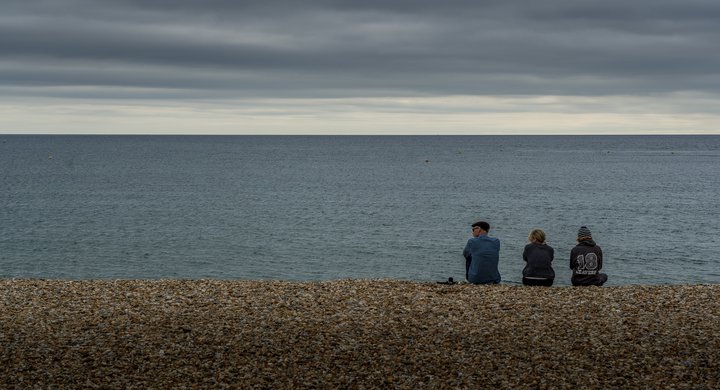 People on beach in Lyme Regis Nick Fewings